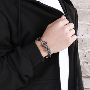 Macro detail of retro punk dragon claw bracelet with vintage stainless steel texture