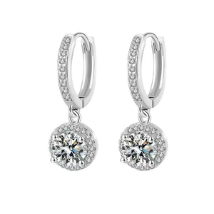 Close-up of sparkling halo stud earrings with round brilliant-cut zircons in silver finish
