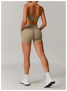 Rear view of women's ribbed khaki yoga set featuring high waist shorts and sports bra