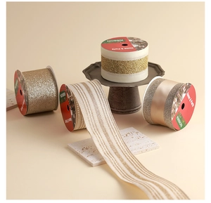 Detailed view of champagne and gold holiday ribbons in glitter and fabric textures