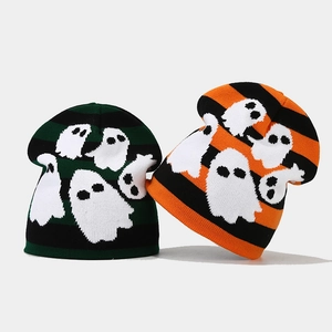 Close-up of knit texture and white ghost pattern on Halloween beanies in two colors
