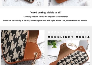 Detail of houndstooth glasses pouch with brown leather trim and golden metal ring chain