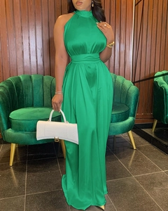 Detail of green satin sleeveless wide-leg jumpsuit with high neck and belted waist