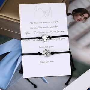 Matching spider and web charm bracelets with black woven rope for couples and friends