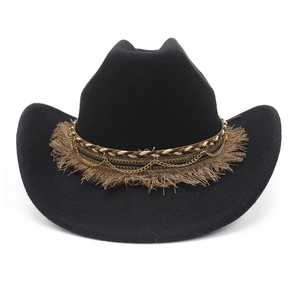 Detail of black felt cowboy hat featuring brown fringe and golden chain trim detail