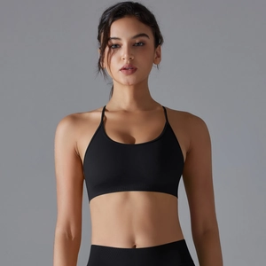 Close-up of seamless black sports bra with cross-back straps and ribbed hem for support