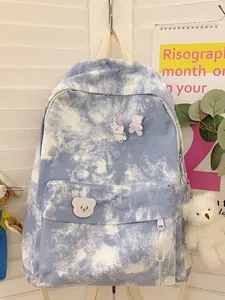 Blue and white tie-dye canvas backpack with cute bear pins and plush keychain