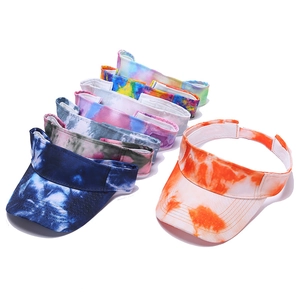 Detailed view of assorted tie-dye sun visors with vibrant gradient patterns and textures