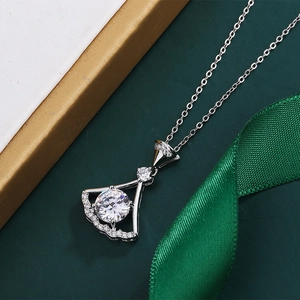 Macro detail of fan shaped silver necklace pendant with sparkling zirconia stones