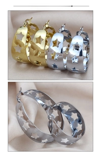 Detail of star-cutout hoop earrings in gold and silver finish with polished surface