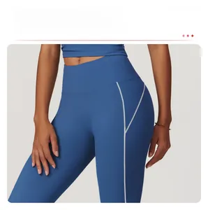 Detail of high-waist electric blue yoga leggings with white contrast stitching