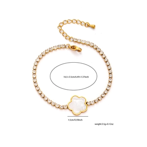 Detail view of gold floral bracelet with white zircon clover pendant and size dimensions