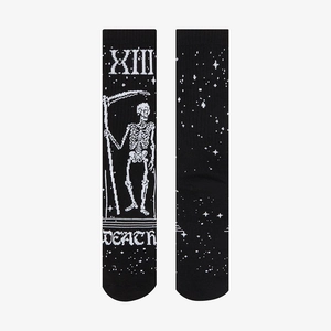 Detail of gothic skull tarot death pattern on black cotton knitted crew socks