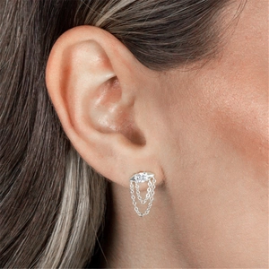 Macro view of sterling silver evil eye stud earring with sparkling diamond tassel chains