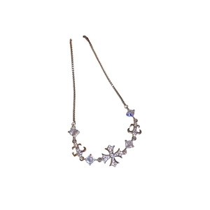 Silver iris cross bracelet with zircon accents and adjustable chain for women