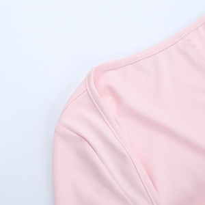 Detail shot of pink mini dress showing precise stitching and smooth jersey fabric texture