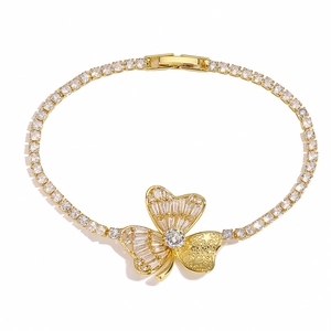 Elegant gold flower bracelet featuring sparkling zircon stones on a white background