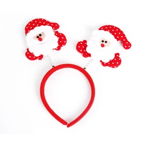 Detail of Christmas headband with plush red Santa Claus hats and white polka dots décor