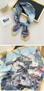 Macro detail of sky blue silk square scarf with illustration of classical architecture