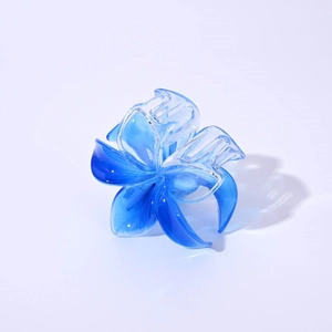 Macro detail of the 8cm blue gradient translucent frangipani flower hair claw clip