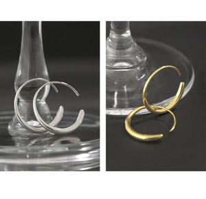 Detailed close-up of S925 sterling silver hoop earrings in silver and gold finishes