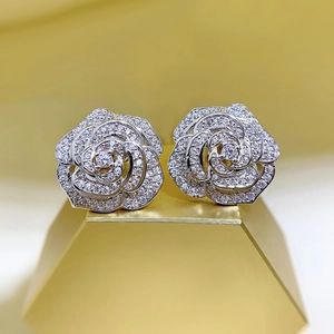 Elegant silver camellia flower stud earrings with shimmering micro-paved cubic zirconia