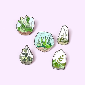 Set of 5 enamel pins featuring miniature greenhouse terrariums with cactus and aloe designs
