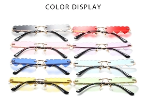 Color options of heart-shaped rimless sunglasses with gold metal temples in eight vibrant shades