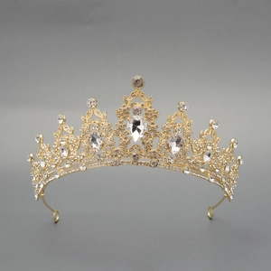 Detail of luxury gold crown featuring intricate baroque rhinestones for weddings