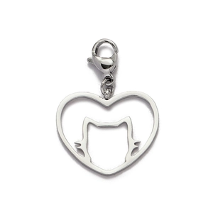 Macro detail of a silver stainless steel hollow heart cat pendant with a lobster clasp