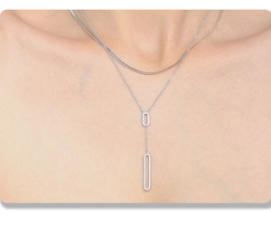 Detail of silver double-layer necklace with micro-pave oval pendants on layered chains