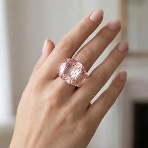 Macro detail of a cushion-cut pink crystal ring with vacuum-plated 18k gold band