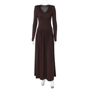 Detail of elegant dark brown V-neck maxi dress with pleated waist on mannequin