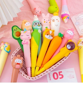 Close-up of cute silicone squishy pens featuring carrot and animal shapes in a pink basket