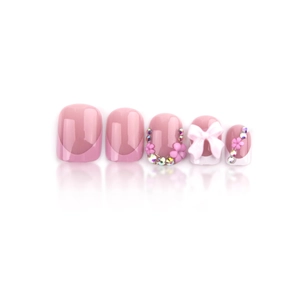 French pink press-on nails featuring rhinestones, flower patterns, and white bows
