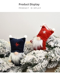 Close-up of knit Christmas gnome ornaments with white beards on frosted pine branches