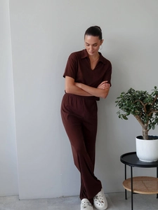 Detail of V-neck knit polo top and high-waist wide-leg pants in deep brown summer set