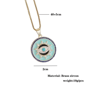 Detail of 18K gold evil eye pendant with blue zircon rim and 45cm box chain dimensions