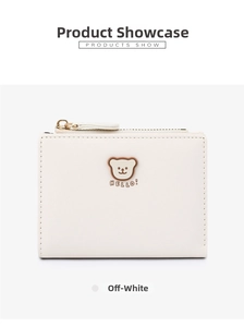 Close-up of beige short wallet with cute cartoon bear print and gold zipper detail
