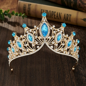 Baroque style gold bridal tiara with sparkling blue rhinestones, elegant wedding hair accessory.