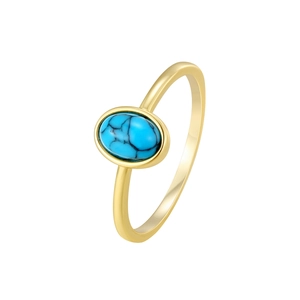 Bohemian gold ring with oval blue turquoise stone and natural black veins on white background
