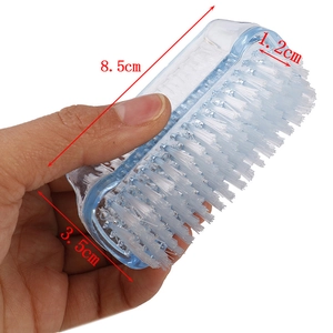 Detail view of a blue plastic medical scrub brush with soft bristles, size 8.5x3.5x1.2cm
