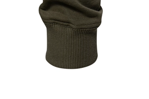 Detailed close-up of dark olive green ribbed knit cuff on a men's casual sweatshirt