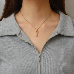 Retro 18K gold plated heart key pendant necklace for women shown on model