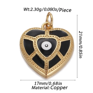 Detailed view of heart-shaped copper pendant with evil eye motif and dimensions