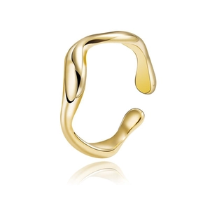 Irregular flowing gold cuff earring with polished finish on white background