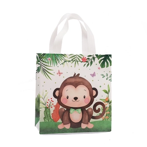 Waterproof non-woven gift bag with cute cartoon monkey print on white background