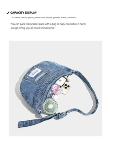 Spacious interior of blue denim crescent bag showing storage capacity for daily essentials