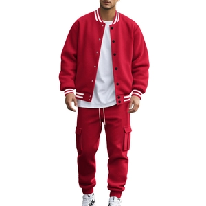 Detail of red athletic track suit featuring white striped ribbed cuffs and collar texture