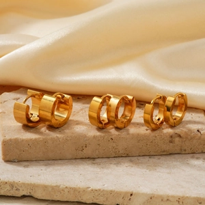 Golden mirror-polished titanium steel hoop earrings set in three different widths